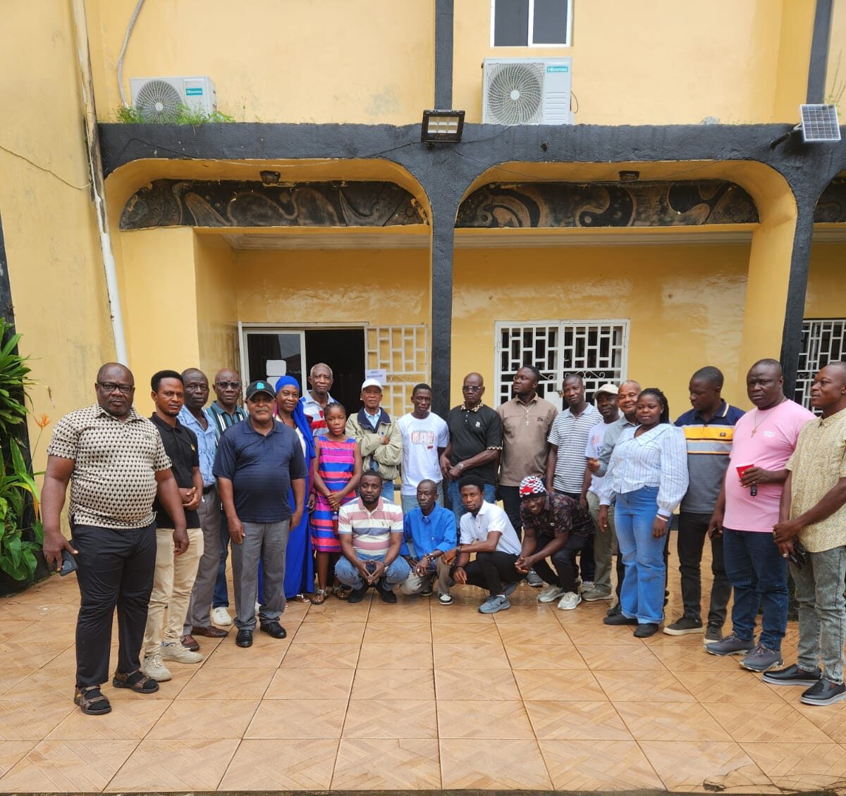 Group of participants gathered outside a meeting venue